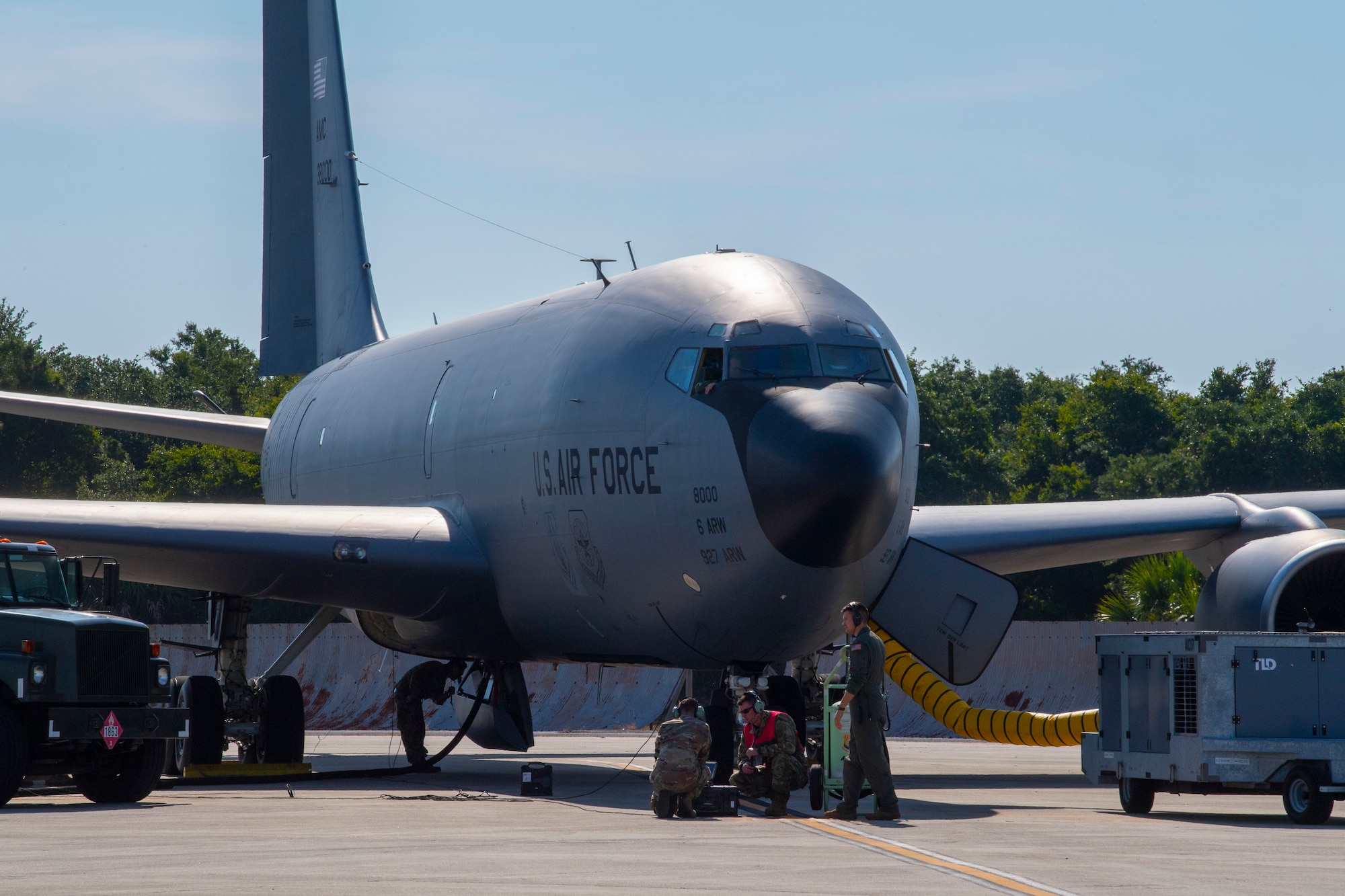 Maintainers from the 6th Aircraft Maintenance Squadron (AMXS) conduct a hot pit refueling on a KC-135 Stratotanker aircraft at MacDill Air Force Base, Florida, May 25, 2021. Hot pit refueling is when a grounded aircraft keeps its engine running while being refueled in order to reduce generation times. (U.S. Air Force photo by Airman 1st Class Hiram Martinez)
