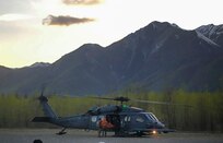 Pararescue personnel with the Alaska Air National Guard’s 212th Rescue Squadron transload an injured hiker from a 210th Rescue Squadron HH-60 Pave Hawk to a Guardian Flight, AirMedCare air ambulance after conducting a multi-agency rescue from an avalanche near Donoho Peak in Wrangle-Saint Elias National Park and Preserve May 26, 2021. (Courtesy photo by Stephens Harper)