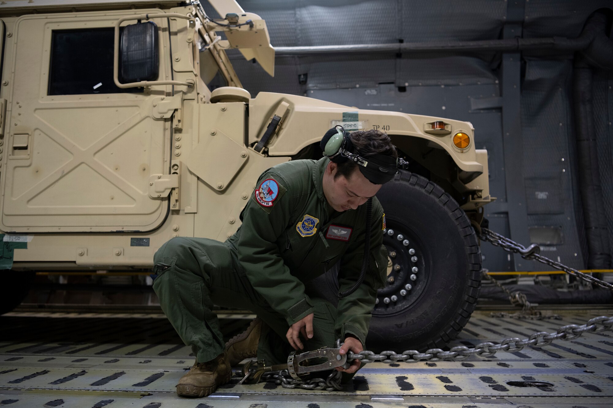 Airman checks a chain lock