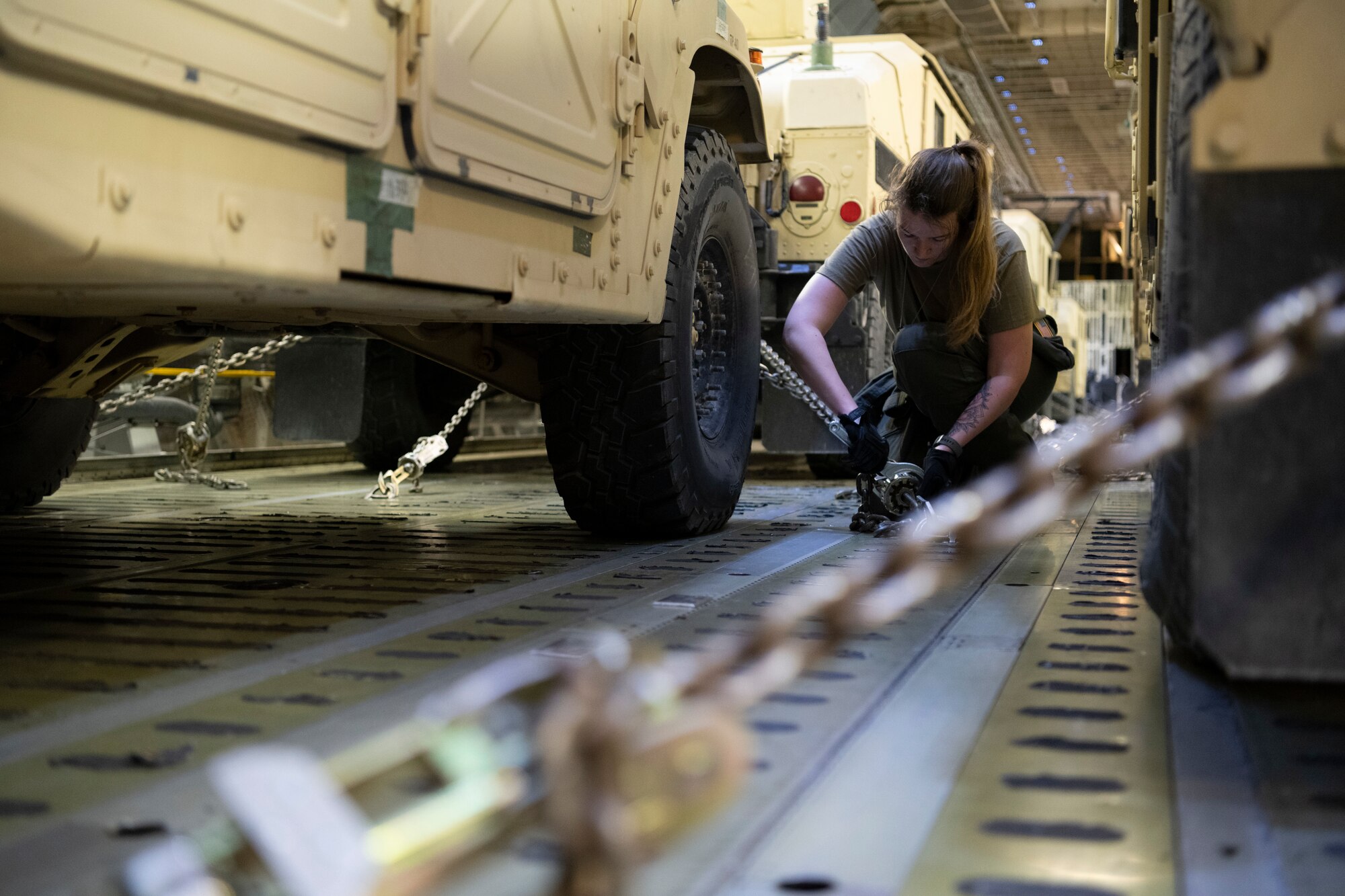 Airman tightens a chain