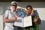 Captain Greg Burton presents the Department of the Navy Superior Civilian Service award to Mr. Kaipo Crowell on April 29, 2021.