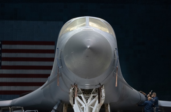 PFS 6.42 project test lead engineer, Capt. Shawn Whitney, BAF project engineer, 1st Lt. Kevin Lasquete, and BAF Project Manager, Justin Duhart, pose for a photo in front of a B-1B Lancer inside the Benefield Anechoic Facility at Edwards Air Force Base, California, May 20. The Lancer, from the 337th Test and Evaluation Squadron, 53rd Wing, out of Dyess Air Force Base, Texas, will be used to conduct testing of PFS 6.42. (Air Force photo by Giancarlo Casem)