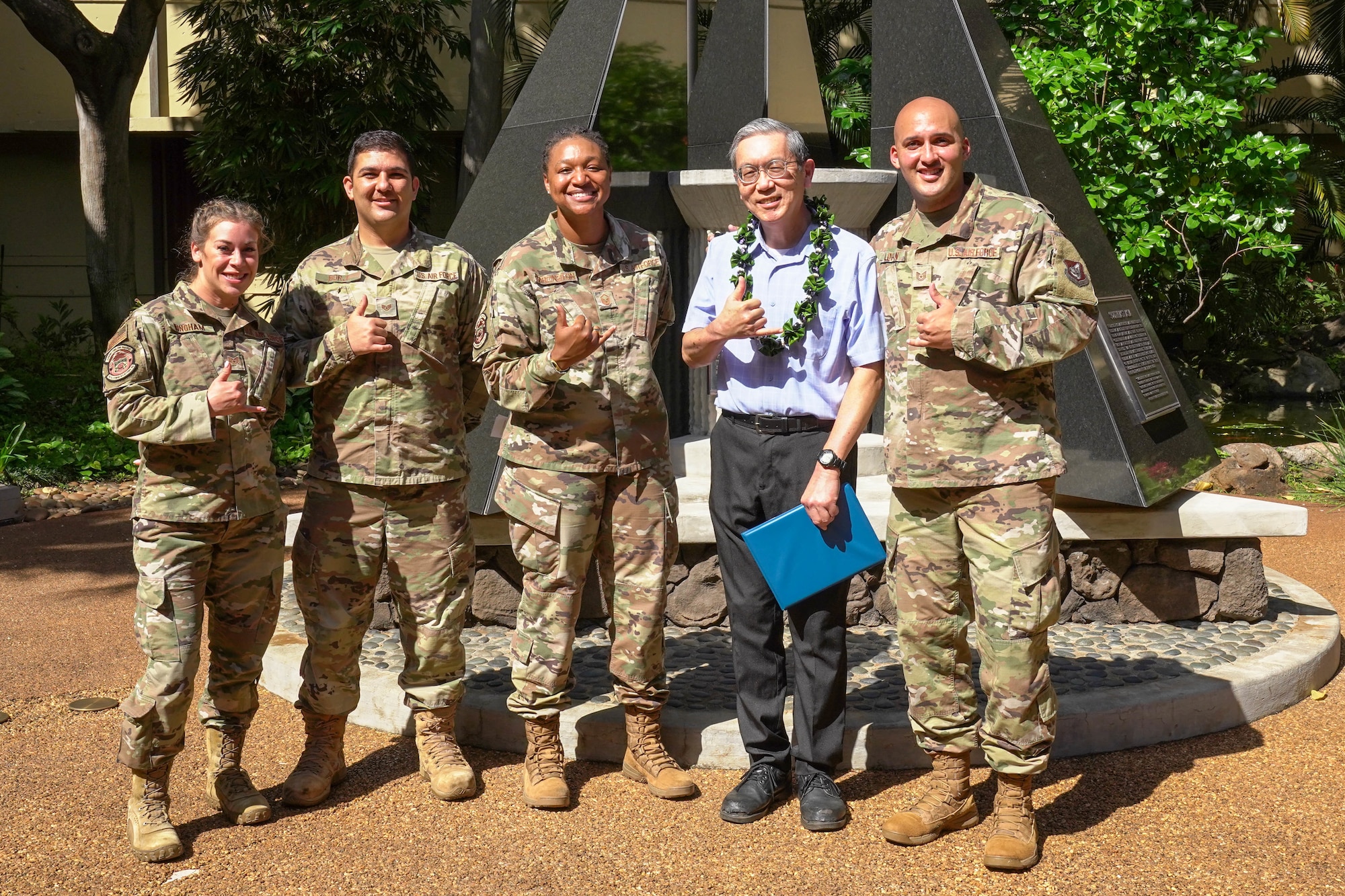 Roy Sakaguchi, 747th Communications Squadron project manager, receives an award for 40 years of civil service at Joint Base Pearl Harbor-Hickam, Hawaii, May 13, 2021. Sakaguchi, a Hawaiian native, graduated with an electrical engineering degree and started working as a plant cable engineer at Wheeler Air Force Base. (U.S. Air Force photo by Airman 1st Class Makensie Cooper)