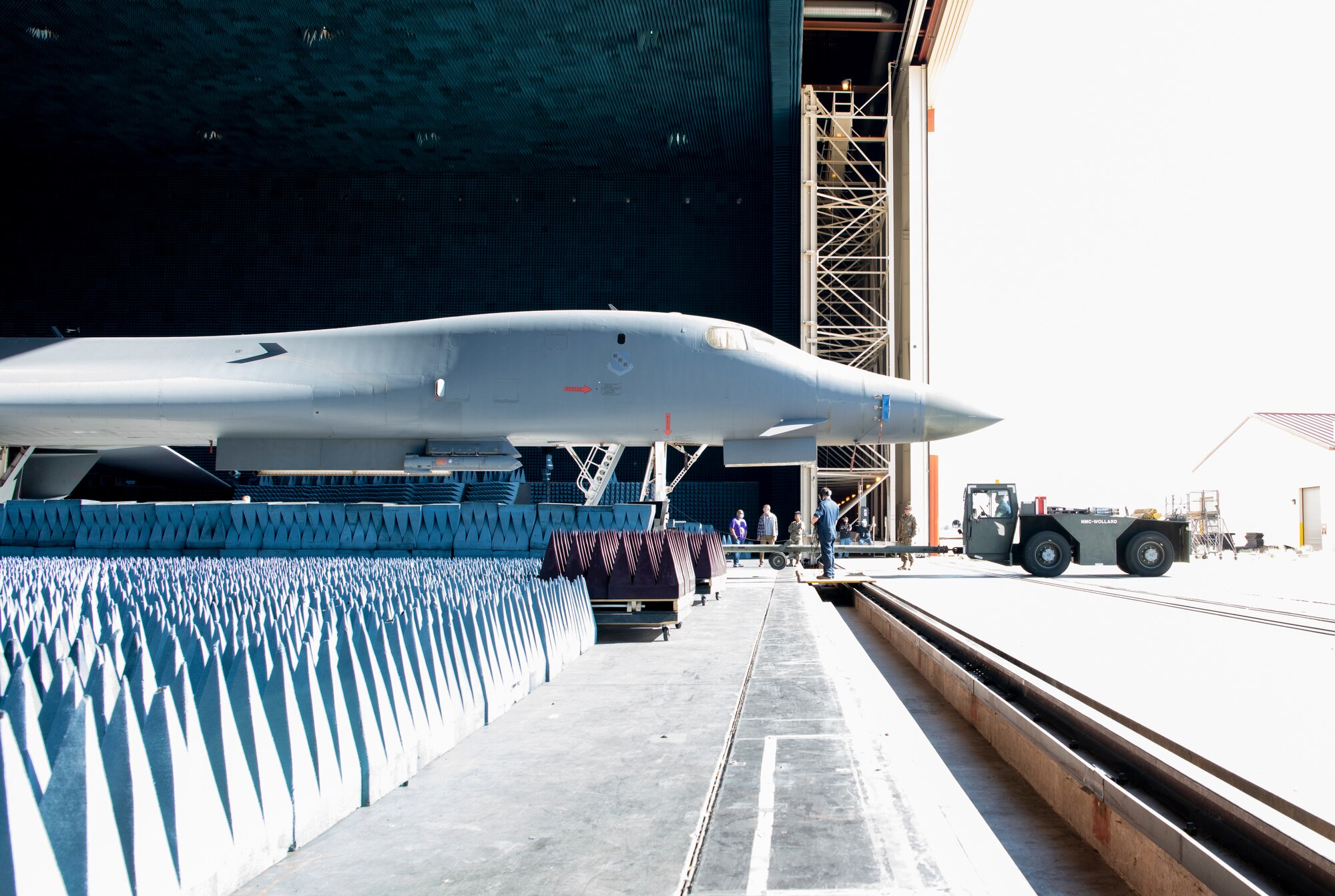 Ground crews move a B-1B Lancer into position at the Benefield Anechoic Facility on Edwards Air Force Base, California, May 20. The Lancer, from the 337th Test and Evaluation Squadron, 53rd Wing, out of Dyess Air Force Base, Texas, will be used to conduct testing of PFS 6.42. (Air Force photo by 1st Lt. Christine Saunders)