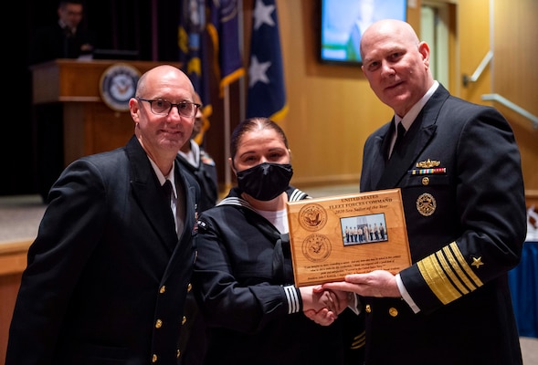 Adm. Christopher W. Grady, commander, U.S. Fleet Forces Command (USFFC), right, and USFFC Fleet Master Chief Rick O�Rawe, left, pose for a photo with USFFC 2020 Sea Sailor of the Year (SOY) Personnel Specialist 1st Class Felicia Oxendine, Commander, Carrier Strike Group Ten, center, during a ceremony at the Joint Forces Staff College, May 27, 2021.