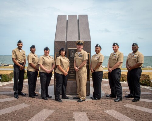 U.S. Fleet Forces Command Fleet Master Chief Rick O�Rawe, center, poses with the 2020 Sea and Shore Sailor of the Year (SOY) finalists during a visit to the USS Cole (DDG 67) memorial at Naval Station Norfolk, May 24, 2021.