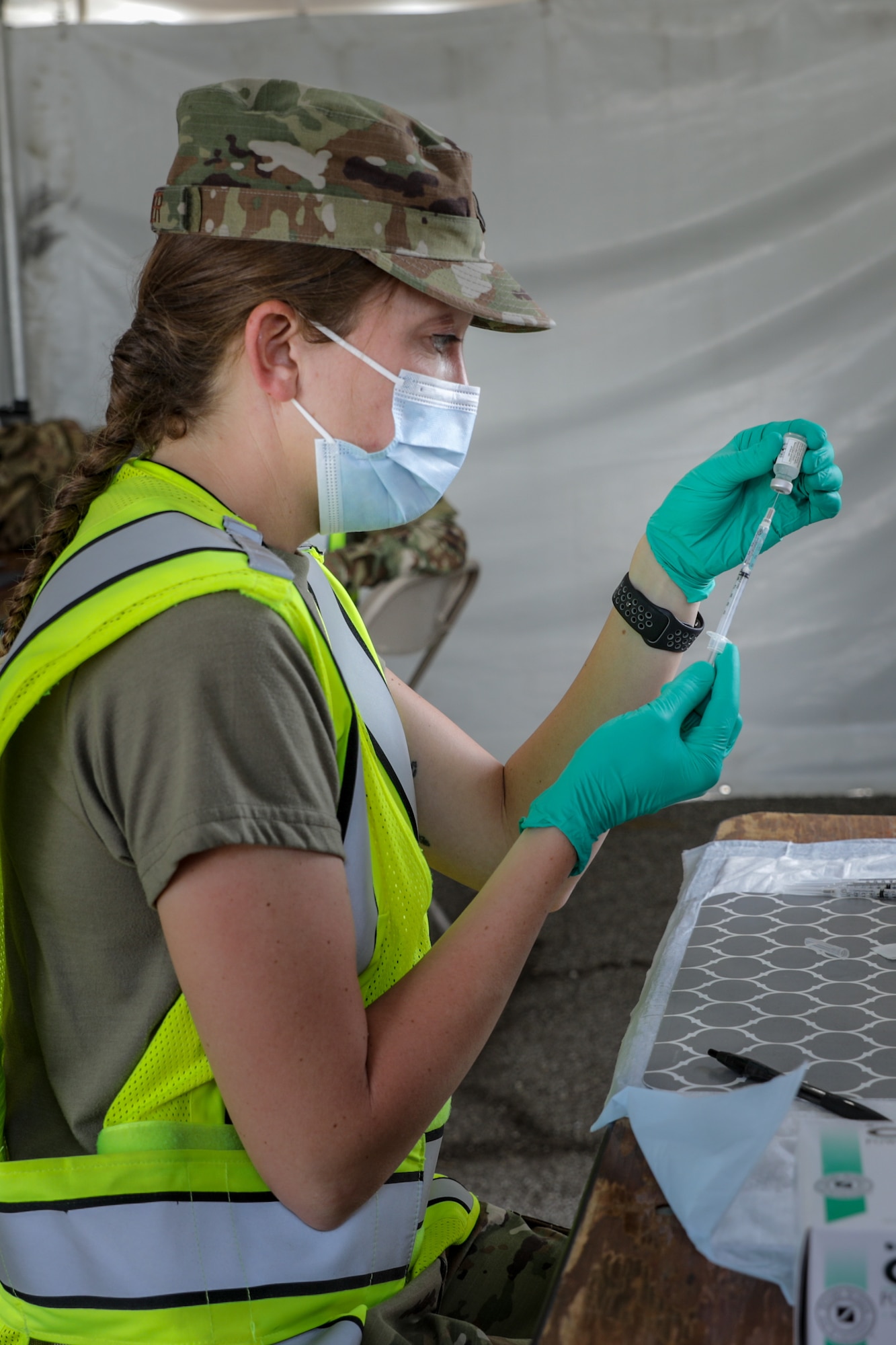 Image of an Airmen working with vaccines.