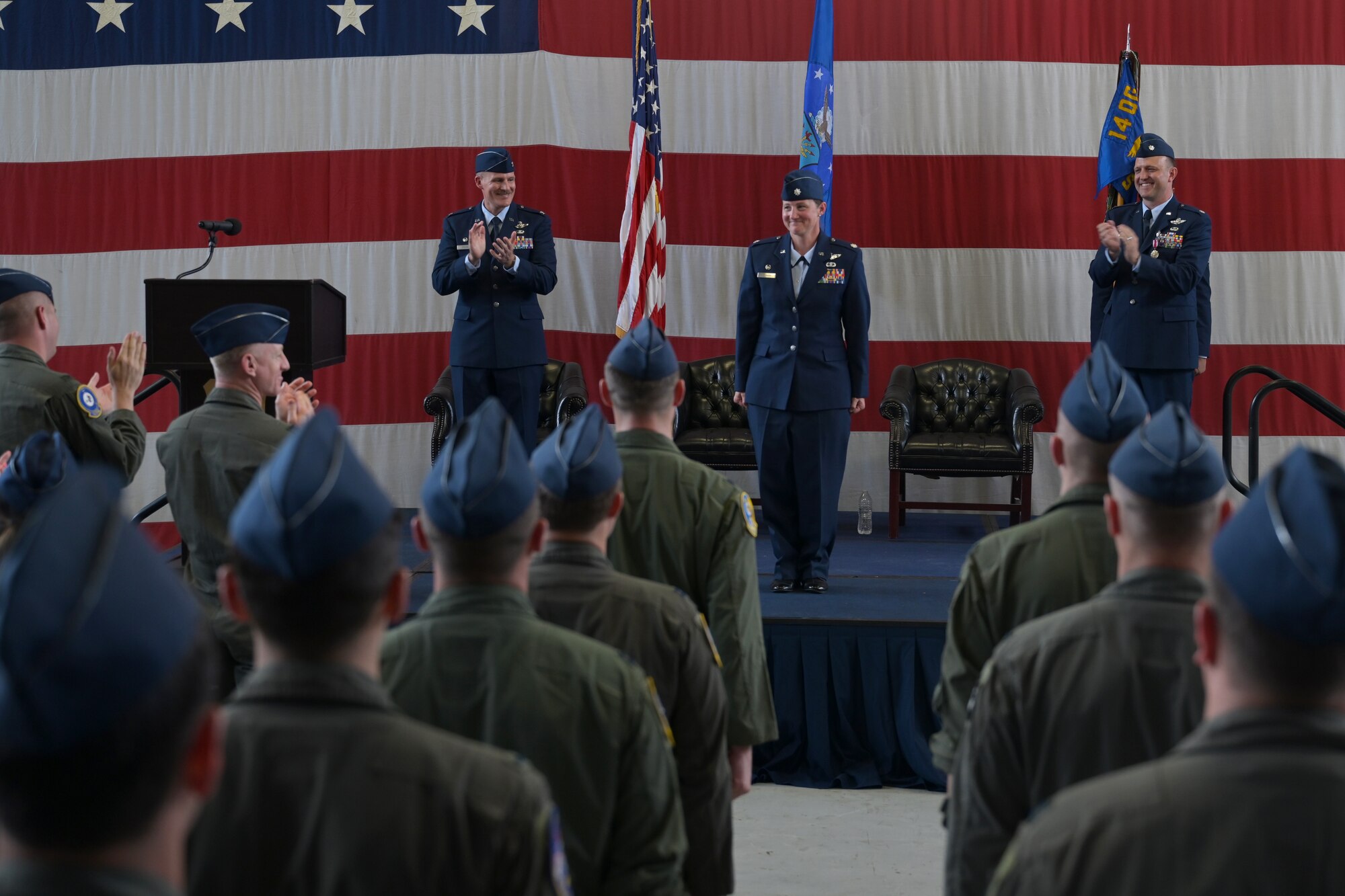Audience members clap for Lt. Col. Valarie Ferrara, 37th Flying Training Squadron commander, at the 37th FTS change of command ceremony May 27, 2021, on Columbus Air Force Base, Miss. The 37th FTS conducts primary flight training in the T-6A Texan II where students learn basic aircraft characteristics and control, takeoff and landing techniques, aerobatics, and night, instrument and formation flying. (U.S. Air Force photo by Senior Airman Jake Jacobsen)