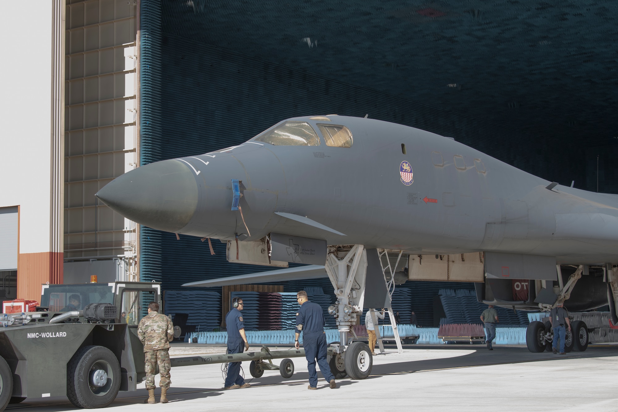 Ground crews move a B-1B Lancer into position at the Benefield Anechoic Facility on Edwards Air Force Base, California, May 20. The Lancer, from the 337th Test and Evaluation Squadron, 53rd Wing, out of Dyess Air Force Base, Texas, will be used to conduct testing of PFS 6.42. (Air Force photo by 1st Lt. Christine Saunders)