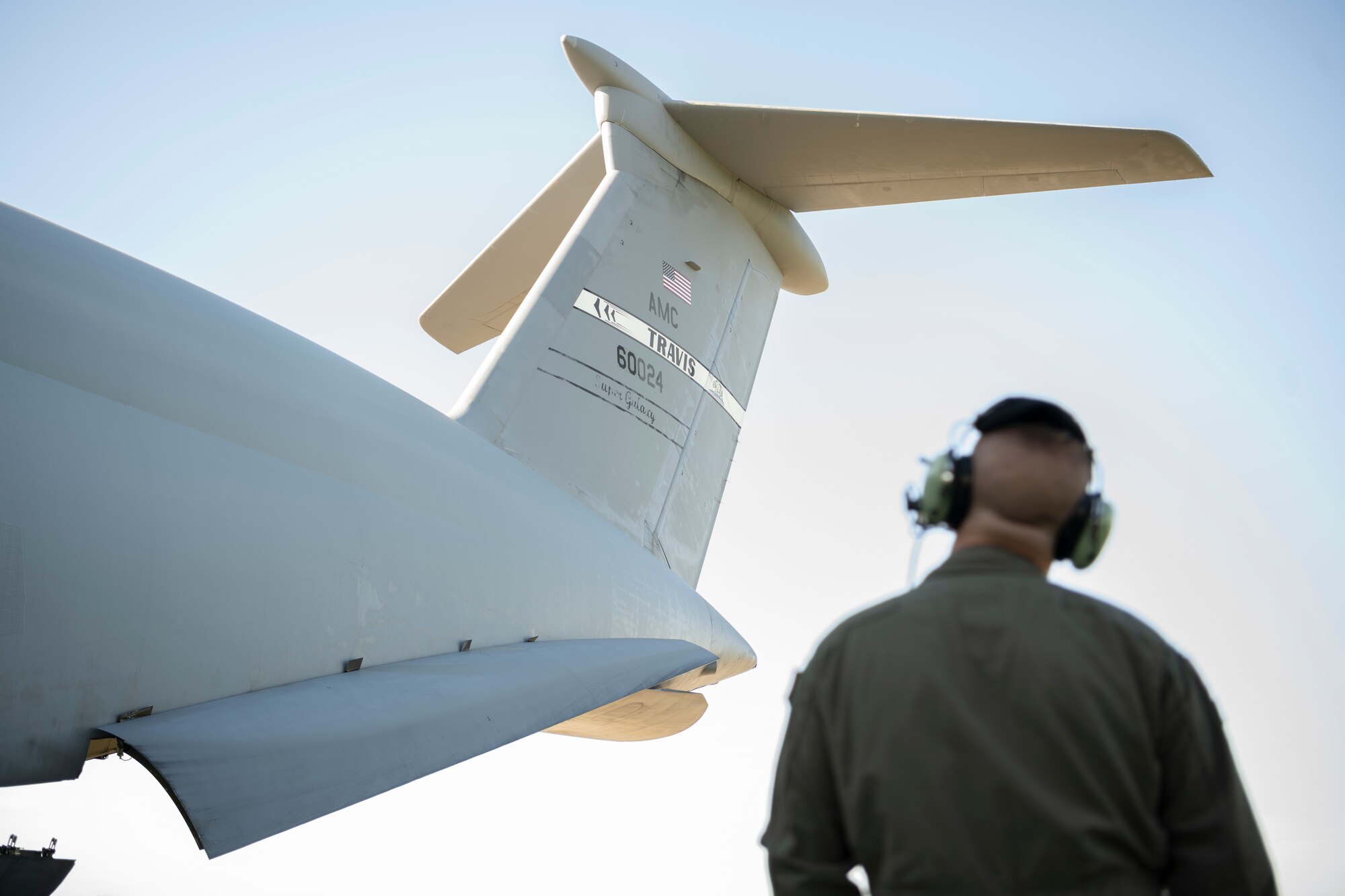 Airman looks at a plane