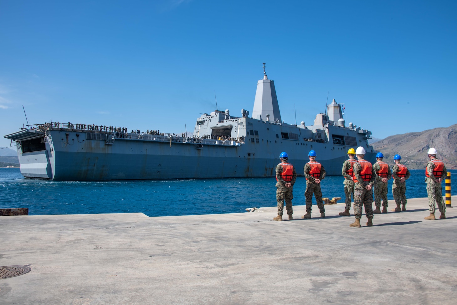 ) The amphibious transport dock ship USS San Antonio (LPD 17) arrives in Souda Bay, Greece, for a scheduled logistics and maintenance stop , May 27, 2021. San Antonio is operating in the U.S. Sixth Fleet area of operations with Amphibious Squadron 4 and the 24th Marine Expeditionary Unit (MEU) as part of the Iwo Jima Amphibious Readiness Group. NSA Souda Bay is an operational ashore base that enables U.S., allied, and partner nation forces to be where they are needed when they are needed to ensure security and stability in Europe, Africa, and Southwest Asia.