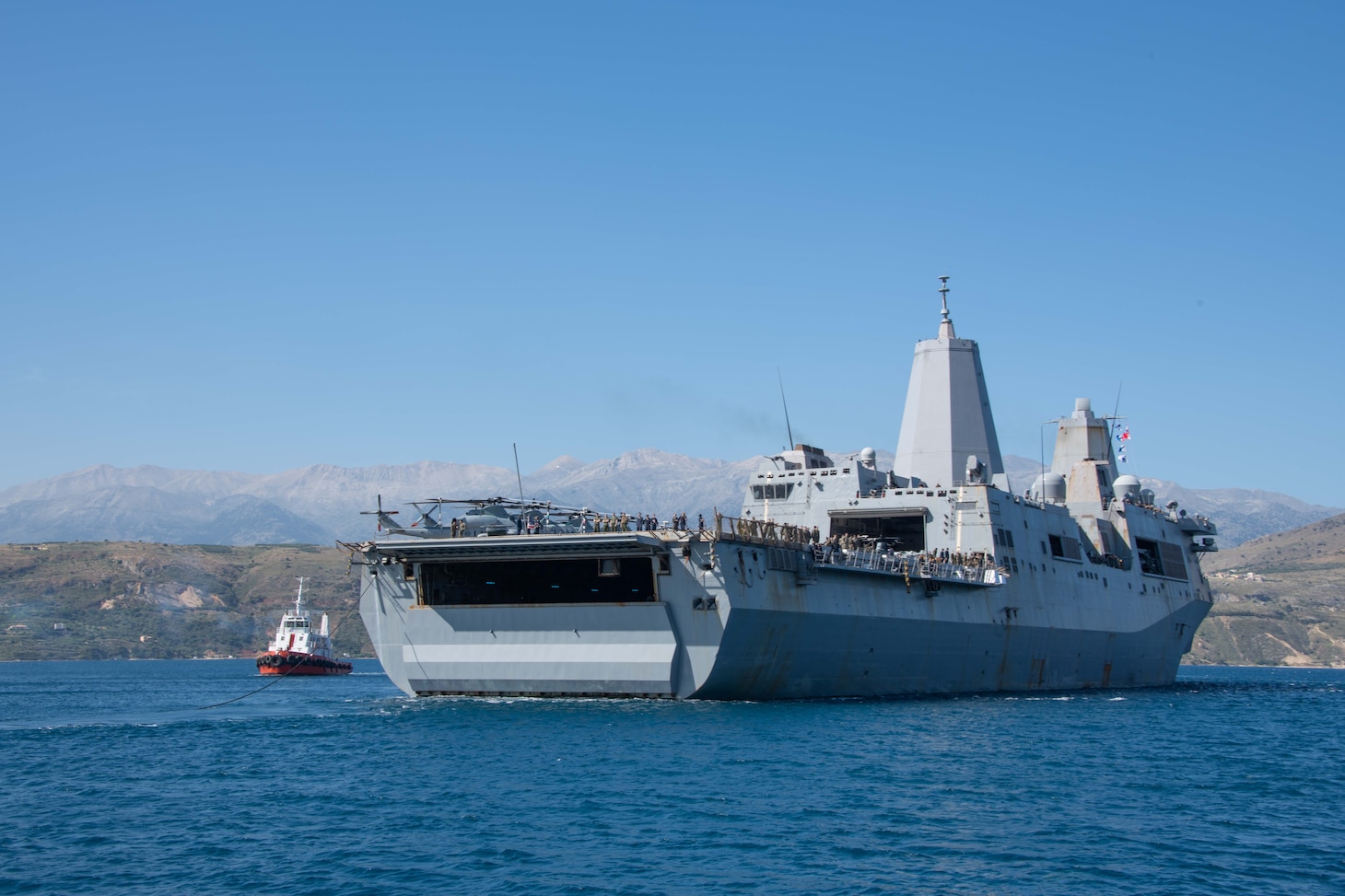 ) The amphibious transport dock ship USS San Antonio (LPD 17) arrives in Souda Bay, Greece, for a scheduled logistics and maintenance stop , May 27, 2021. San Antonio is operating in the U.S. Sixth Fleet area of operations with Amphibious Squadron 4 and the 24th Marine Expeditionary Unit (MEU) as part of the Iwo Jima Amphibious Readiness Group. NSA Souda Bay is an operational ashore base that enables U.S., allied, and partner nation forces to be where they are needed when they are needed to ensure security and stability in Europe, Africa, and Southwest Asia.