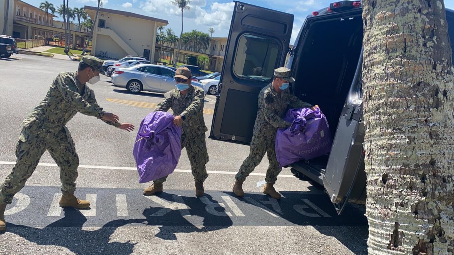 SANTA RITA, Guam (April 23, 2021) – U.S. Navy Reservists assigned to NAVSUP Fleet Logistics Center Yokosuka Site Marianas form a working party to offload outgoing mail from visiting ships onboard Naval Base Guam. Throughout April 2021 Site Marianas shipped out nearly 65,000 pounds of mail.