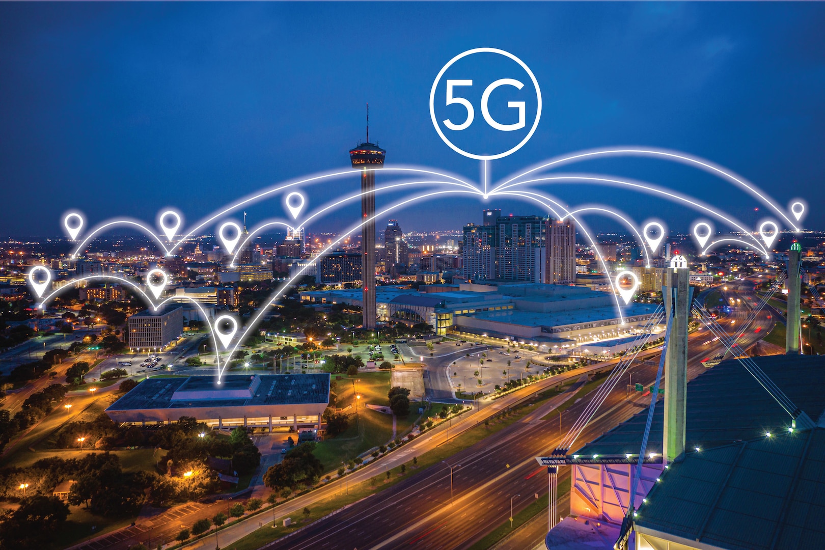 In a graphic illustration, various points in a cityscape are connected with white lines that converge below a circle containing the term "5G."