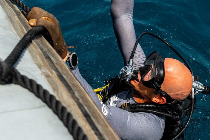 210521-N-KC128-0107 HANNOUSH, Lebanon (May 21, 2021) – An explosive ordnance disposal technician assigned to Commander, Task Force 52 enters the water during a subject matter expert exchange dive with members of the Lebanese Armed Forces as part of exercise Resolute Union 21 in the Mediterranean Sea, May 21. Resolute Union 21 is an annual, bilateral explosive ordnance disposal and maritime security exercise between U.S. 5th Fleet and Lebanese Armed Forces to enhance mutual capabilities and interoperability. (U.S. Navy photo by Mass Communication Specialist 1st Class Daniel Hinton)