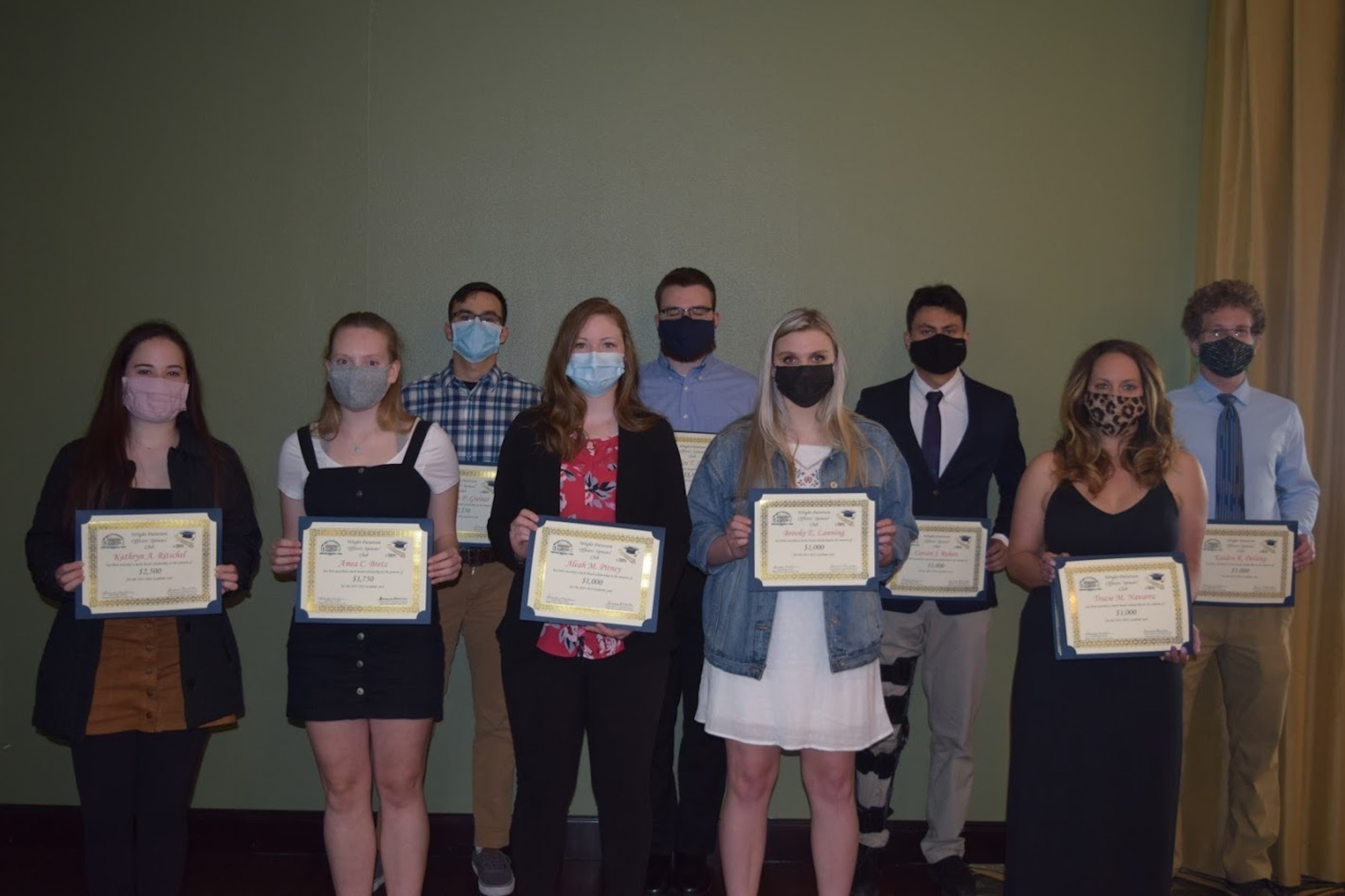 The 2021 Wright-Patterson Officers’ Spouses’ Club scholarship winners are (front row, from left) Kathryn Ritschel, Amea Bretz, Aleah Pitney, Brooke Lanning and Tracie Navarra. (Back row, from left) Christian Greiner, Landen Stricker, Carson Rohan and Kaiden Delsing. Not pictured: Riley Gallegos and Ryan Massie. (Contributed photo)