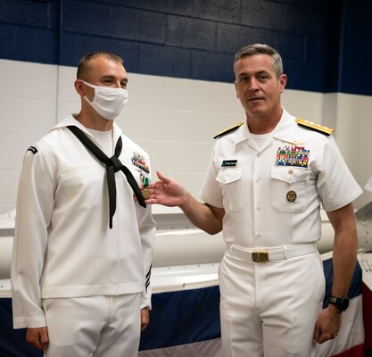 GREAT LAKES, Ill. (May 27, 2021) Rear Adm. Pete Garvin, commander, Naval Education and Training Command presents the Navy and Marine Corps Commendation Medal to Interior Communications Electrician 1st Class Robert Copeland III for his selection as the 2020 NETC Sailor of the Year. Fifteen finalists for SOY serving throughout the MyNavy HR Force Development domain rose through a number of competitions to represent the top achievers in recruiting and training from a pool of more than 4,490 military members. (U.S. Navy photo by Matt Mogle/Released)