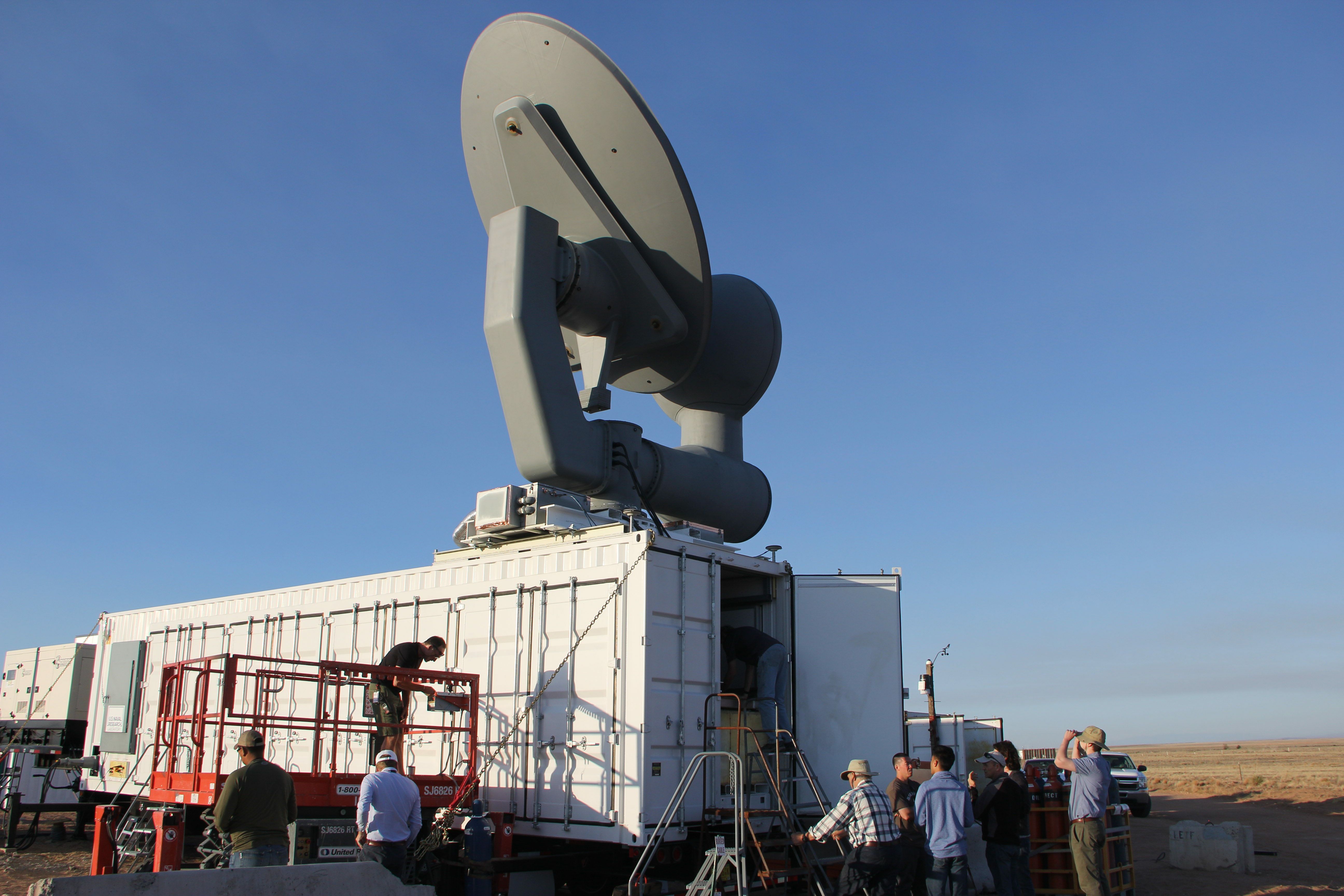 Air Force Research Laboratory researchers making final touches on the CHIMERA equipment prior to conducting system tests. (Courtesy photo)