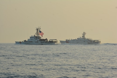 ARABIAN GULF (May 24, 2021) – Patrol boat USCGC Maui (WPB 1304), left, and fast response cutter USCGC Robert Goldman (WPC 1142) transit the Arabian Gulf en route to Bahrain, May 24. Robert Goldman and USCGC Charles Moulthrope (WPC 1141) are the newest additions to Patrol Forces Southwest Asia (PATFORSWA), which is comprised of six 110' cutters, the Maritime Engagement Team, shore side support personnel, and is the Coast Guard's largest unit outside of the U.S. playing a key role in supporting Navy security cooperation, maritime security, and maritime infrastructure protection operations in the U.S. 5th Fleet area of operations. (U.S. Coast Guard photo by Seaman Logan Kaczmarek)
