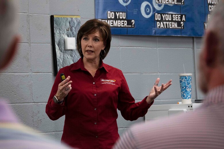 Civilian talking to group of civilians.