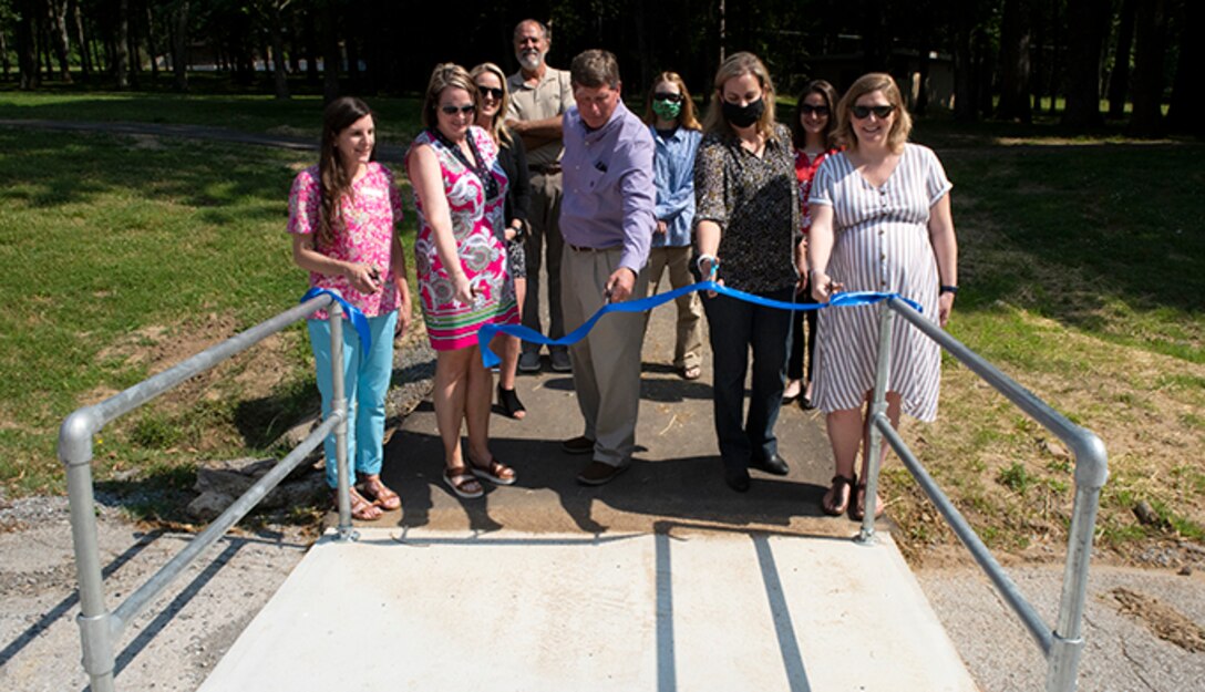 Officials with the Tennessee Health Department, Sumner County Health Department, Sumner County, and U.S. Army Corps of Engineers Nashville District dedicate a .5-mile exercise trail May 25, 2021 at Rockland Recreation Area on the shoreline of Old Hickory Lake. The ribbon cutting culminated a joint effort to construct a loop fitness trail to provide a pathway for people to safely exercise at the USACE-operated project. (USACE photo by Lee Roberts)