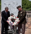 Gov. Phil Scott and Maj. Gen. Greg Knight, Vermont’s adjutant general, lay a wreath at the Fallen Heroes Memorial during a rededication ceremony at Camp Johnson, Vermont, May 27, 2021. The laying of flowers is custom for dedicating the graves of fallen service members as part of Memorial Day observances. (U.S. Army National Guard photo by Don Branum)