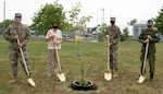 Left to right, Col. Paul M. Bishop, EADS commander; Rome Mayor Jackie Izzo; Col. Joseph F. Roos, 224th Air Defense Group commander, and Lt. Col. Josh Klemen, EADS Canadian Detachment commander, planted the 9/11 Survivor Tree seedling at EADS during a short ceremony May 26, 2021.  The seedling was taken from a tree found in the World Trade Center rubble in October 2001 and nursed back to health.