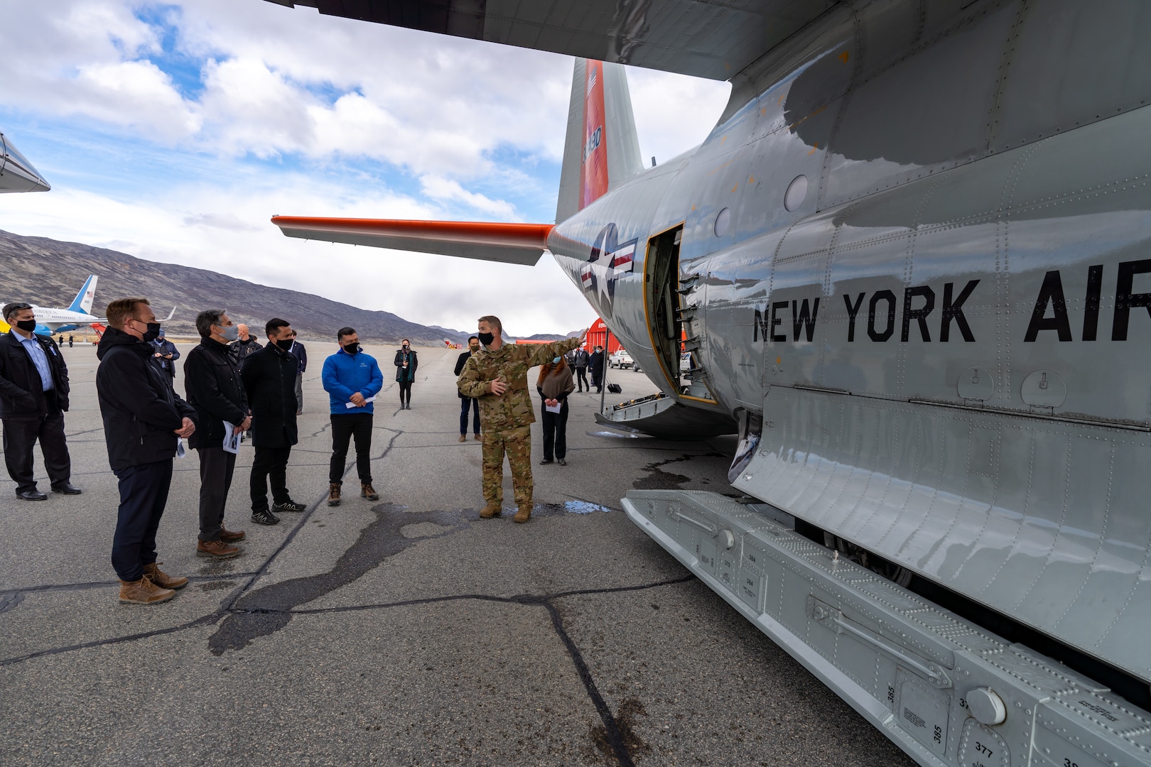 New York Air National Guard Maj. Shay Price, an LC-130 navigator, briefs Secretary of State Antony J. Blinken and Greenland Premier Múte Bourup Egede, and other officials, about the LC-130s used by the wing to support climate science research on Greenland's Ice Cap at the Kangerlussuaq, Greenland, airport May 20, 2021. The 109th Airlift Wing operates from the airport when supporting National Science Foundation research in Greenland.