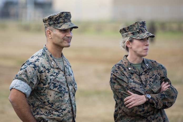 U.S. Marine Corps Col. Speros Koumparakis, commanding officer of Marine Corps Base Hawaii, and Lt. Col. Carrie Batson, commanding officer of Headquarters Battalion, MCBH, oversee the events of HQBN’s Warrior Night event, MCBH, May 20, 2021. The HQBN Warrior Night event included various team-building activities, and aimed to foster unit cohesion and esprit de corps. (U.S. Marine Corps photo by Sgt. Luke Kuennen)