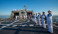 Fire Controlman 1st Class Daniel Thayer from Durango, Colorado, left, and Lieutenant Junior Grade Dwayne Williams from Pearland, Texas, participate in a wreath laying ceremony held in commemoration of the 63rd anniversary of the burial at sea in honor of the Tomb of the Unknown Soldier aboard the guided-missile destroyer USS Truxton (DDG-103). Truxton is currently underway conducting Ready Five qualifications