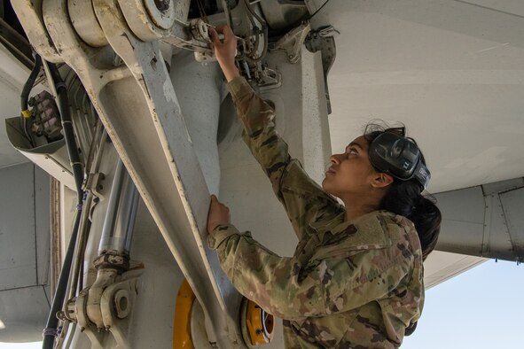 Airman 1st Class Sneha Lakshminarayanan, a crew chief with the 749th Aircraft Maintenance Squadron, works on a KC-10 Extender aircraft.