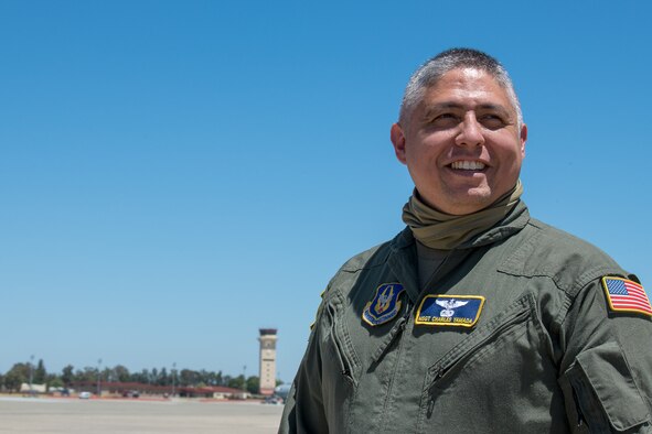 Master Sgt. Charles Yamada, 312th Airlift Squadron flight engineer, poses on the flight line at Travis Air Force Base, California.