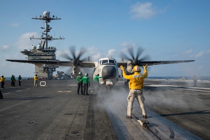 Chief Aviation Boatswain's Mate (Handling) Jerome Gaynor Jr., from Portsmouth, Virginia, directs a C-2A Greyhound, attached to the "Greyhawks" of Airborne Command and Control Squadron (VAW) 120, on the flight deck of the Nimitz-class aircraft carrier USS Harry S. Truman (CVN 75) during carrier qualifications after completing an extended incremental availability.