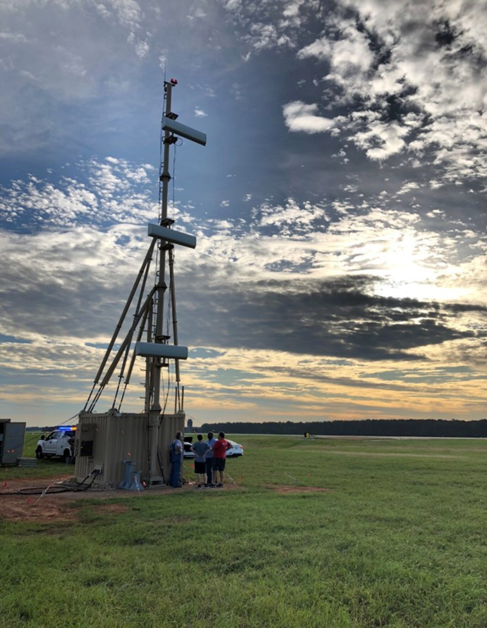 A team finalizes the setup of the Deployable Instrument Landing Systems glideslope mast and shelter at Shaw Air Force Base, S.C., in early 2019. The D-ILS program office, headquartered at Hanscom Air Force Base, Mass., deployed the technology to Shaw in September 2019 to support runway repair operations. (Courtesy photo)