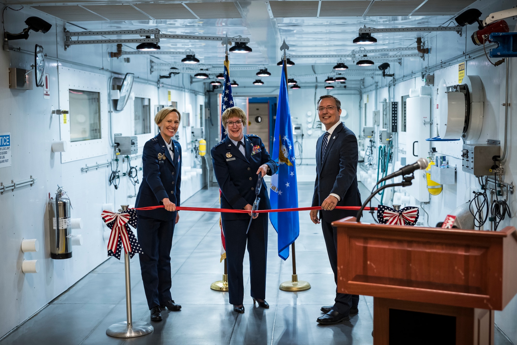 Lt. Gen. Dorothy Hogg, Air Force Surgeon General, cuts the ribbon with Air Force Research Laboratory Commander Maj. Gen. Heather Pringle and 711th Human Performance Wing Acting Director Darrell Phillipson, during a ceremony May 27 signifying the opening of the research altitude chambers in AFRL. (U.S. Air Force photo by Richard Eldridge)