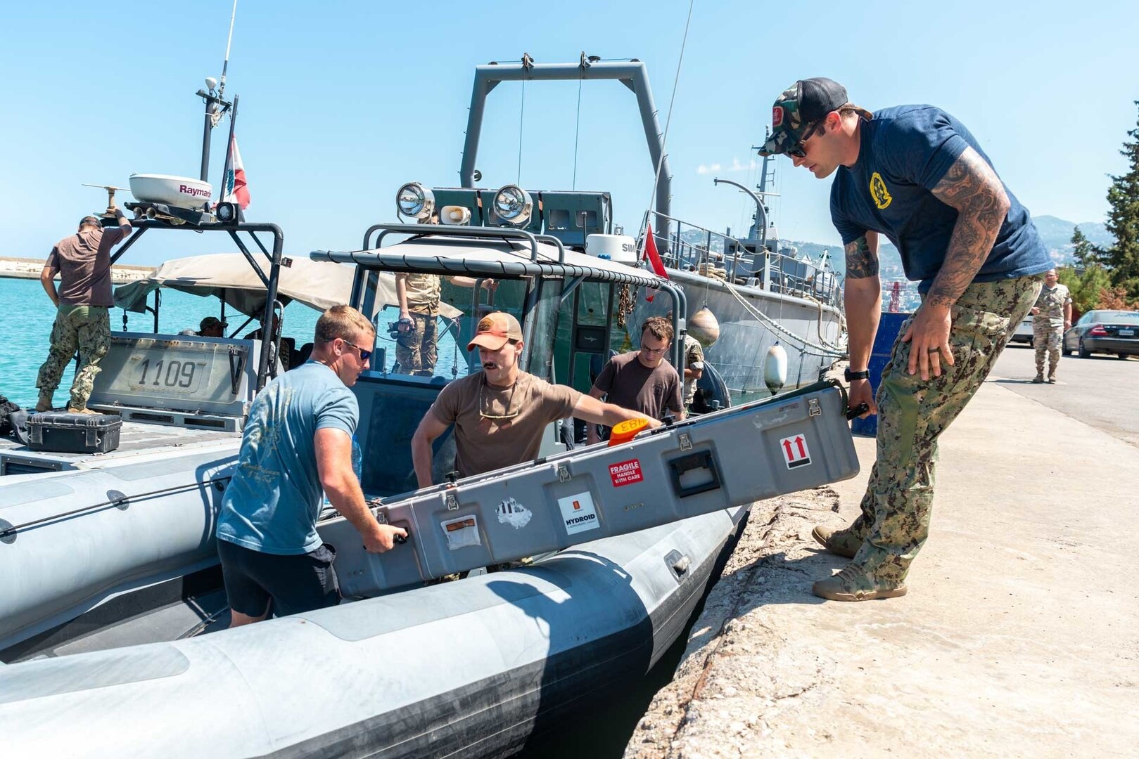 210524-N-KC128-0003 HANNOUSH, Lebanon (May 24, 2021) – Sailors assigned to Commander, Task Force 52 load an unmanned underwater vehicle aboard a rigid-hull inflatable boat during a mine-searching demonstration with members of the Lebanese Armed Forces as part of exercise Resolute Union 21 in Hannoush, Lebanon, May 24. Resolute Union 21 is an annual, bilateral explosive ordnance disposal and maritime security exercise between U.S. 5th Fleet and Lebanese Armed Forces to enhance mutual capabilities and interoperability. (U.S. Navy photo by Mass Communication Specialist 1st Class Daniel Hinton)