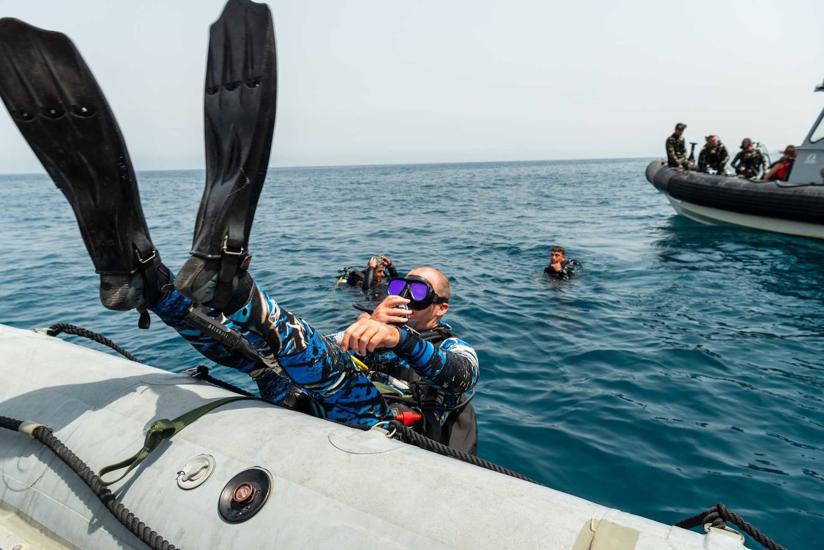 210521-N-KC128-0114 HANNOUSH, Lebanon (May 21, 2021) – An explosive ordnance disposal technician assigned to Commander, Task Force 52 enters the water during a subject matter expert exchange dive with members of the Lebanese Armed Forces as part of exercise Resolute Union 21 in the Mediterranean Sea, May 21. Resolute Union 21 is an annual, bilateral explosive ordnance disposal and maritime security exercise between U.S. 5th Fleet and Lebanese Armed Forces to enhance mutual capabilities and interoperability. (U.S. Navy photo by Mass Communication Specialist 1st Class Daniel Hinton)