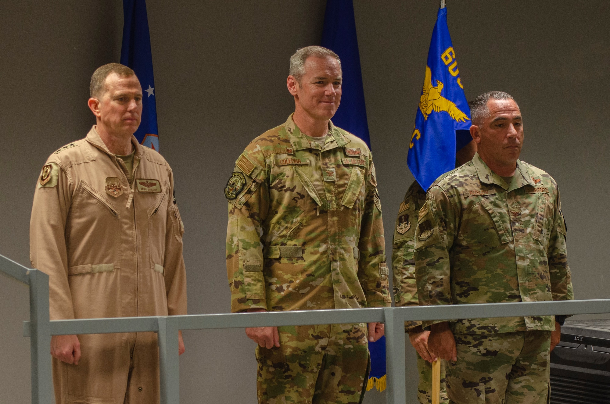 U.S. Air Force Lt. Gen. Greg Guillot, 9th Air Force (Air Forces Central) commander, left, Col. Frederick A. “Trey” Coleman III, 609th Air Operations Center outgoing commander, center, and Joshua Koslov, 609th AOC commander, stand during the 609th AOC change of command ceremony Al Udeid Air Base, Qatar, May 27, 2021. The Airmen of the 609th AOC work alongside joint and international partners from 18 nations to plan, produce, and execute the daily Air Tasking Order on behalf of Guillot, who also serves as the Combined Forces Air Component Commander. (U.S. Air Force photo by Tech. Sgt. Dylan Nuckolls)