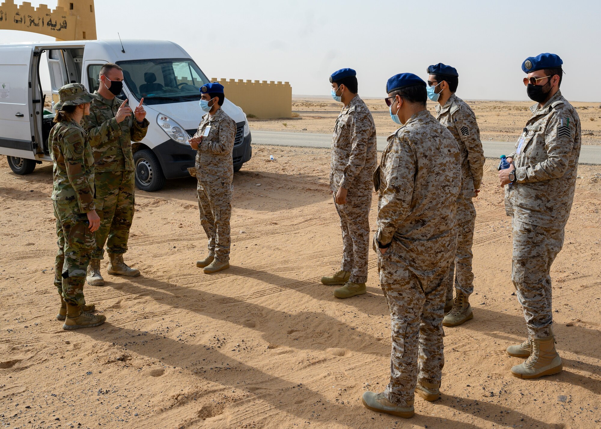 U.S. Air Force personnel from the 378th Civil Engineer Squadron emergency management flight explain the chemical, biological, radiological and nuclear defense exercise with members of the Royal Saudi Air Force, PSAB, Kingdom of Saudi Arabia, May 26, 2021. The combined exercise demonstrates the emergency management integration between USAF and RSAF CBRN response units while also familiarizing each unit with the other’s techniques and procedures. (U.S. Air Force photo by Senior Airman Samuel Earick)