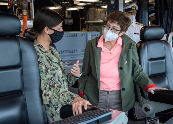 APRA HARBOR, Guam (May 28, 2021) Lt j.g. Amber Mendez, left, from Carlsbad, Calif., gives German Defense Minister Annegret Kramp-Karrenbauer a tour of the pilot house aboard Independence-variant littoral combat ship USS Charleston (LCS 18), May 28. Charleston, part of Destroyer Squadron Seven, is on a rotational deployment operating in the U.S. 7th fleet area of operations to enhance interoperability with partners and serve as a ready-response force in support of a free and open Indo-Pacific region. (U.S. Navy photo by Mass Communication Specialist 3rd Class Adam Butler)