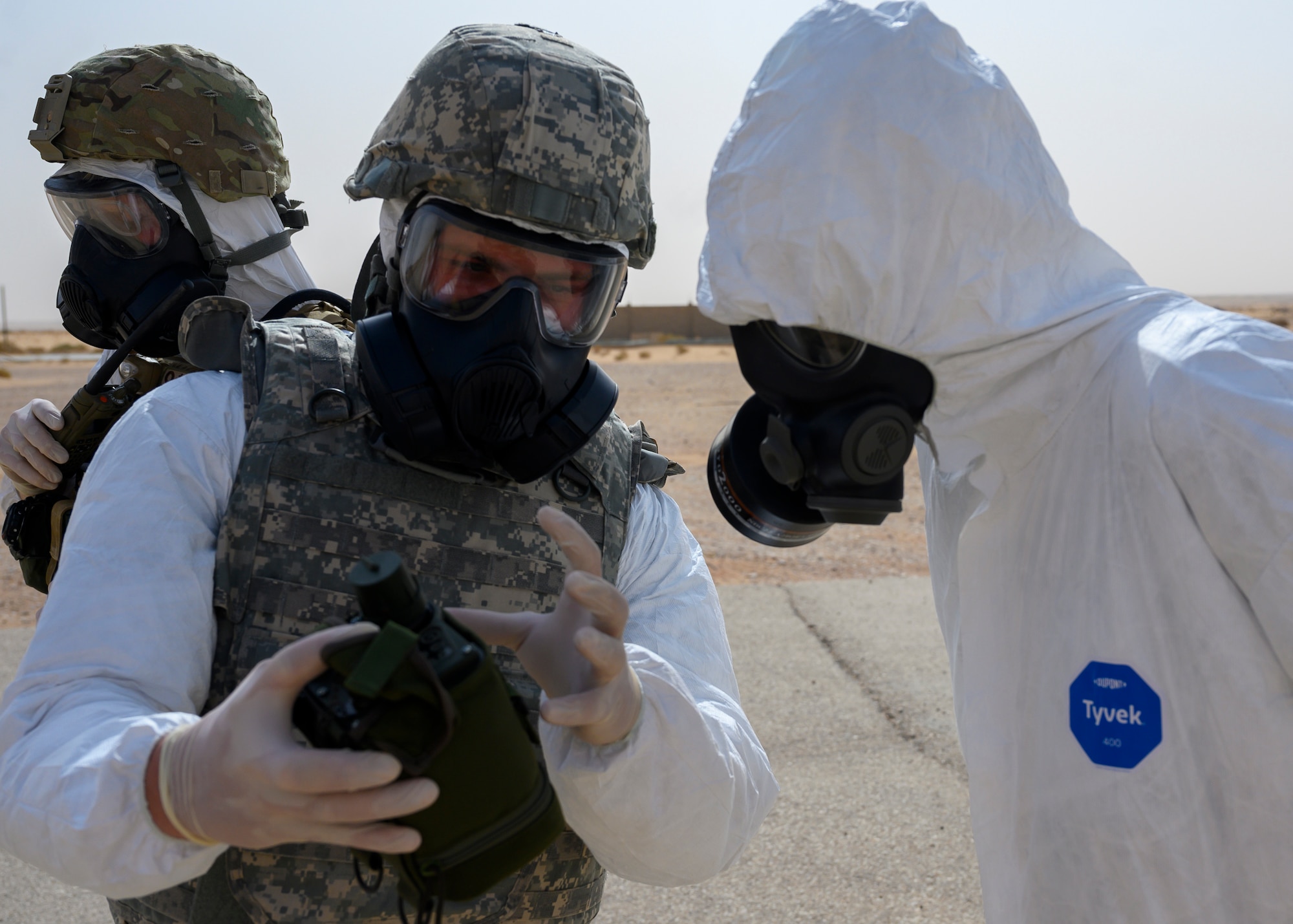Members of the 378th Civil Engineer Squadron emergency management flight discuss the equipment necessary for a chemical, biological, radiological and nuclear response during an exercise with members of the Royal Saudi Air Force, Prince Sultan Air Base, Kingdom of Saudi Arabia, May 26, 2021. The combined exercise demonstrates the emergency management integration between USAF and RSAF CBRN response units while also familiarizing each unit with the other’s techniques and procedures. (U.S. Air Force photo by Senior Airman Samuel Earick)