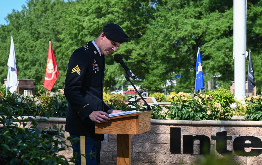 The narrator begins the Memorial Day retreat ceremony at Joint Base Langley-Eustis, Virginia, May 27, 2021. The ceremony honored the sacrifice of fallen service members and their families. (U.S. Air Force photo by Senior Airman Sarah Dowe)