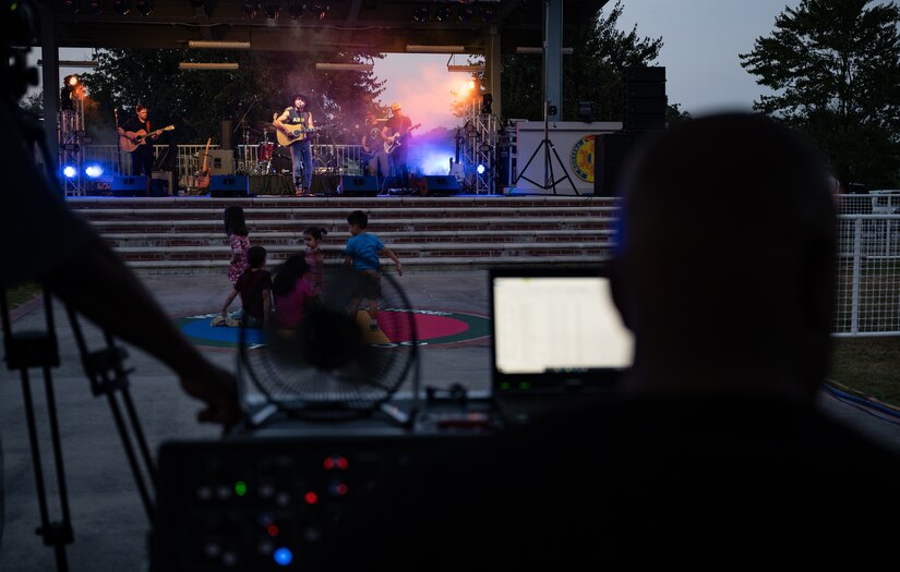 Audio engineers manage sound levels during the Austin Moody concert at Joint Base Langley-Eustis, Virginia, May 27, 2021. Nearly 100 service members and their families attended the concert put on by JBLE Morale, Welfare, and Recreation. (U.S. Air Force photo by Staff Sgt. Chandler Baker)