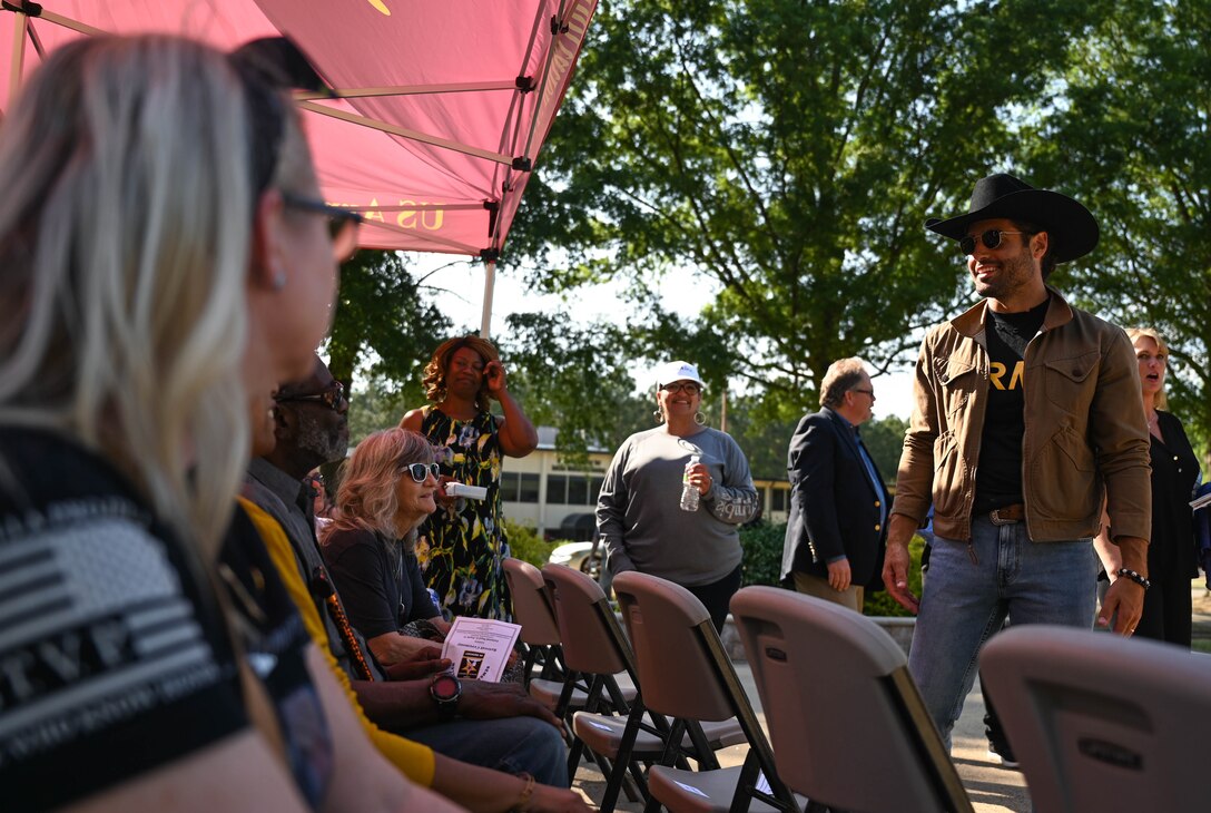 Country music artist Austin Moody, greets and thanks Gold Star family members after the Memorial Day retreat ceremony at Joint Base Langley-Eustis, Virginia, May 27, 2021. Moody performed a concert afterwards at the U.S. Army Training and Doctrine Command stage. (U.S. Air Force photo by Senior Airman Sarah Dowe)