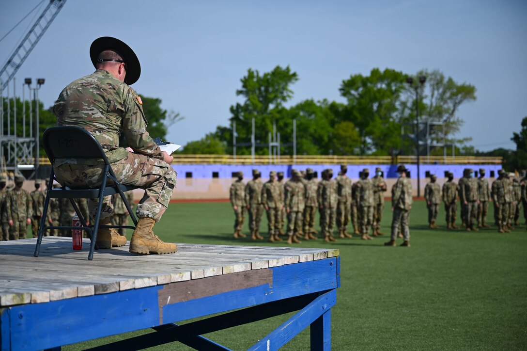 A U.S. Army Drill Sergeant reviews the scoring sheet during the Drill and Ceremony competition at Joint Base Langley-Eustis, Virginia, May 22, 2021. Drill and Ceremony competitions promote excellence and camaraderie among Soldiers during Advanced Individual Training.  (U.S. Air Force photo by Senior Airman John Foister)