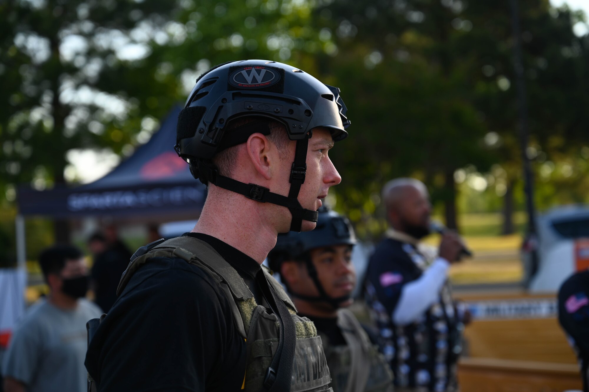 Two U.S. Soldiers watch other competitors run the course while waiting for their turn during the Military Battle Challenge obstacle course at Joint Base Langley-Eustis, Virginia, May 22, 2021. The Military Battle Challenge is a timed obstacle course that tests Soldiers' abilities over nine separate tasks. (U.S. Air Force photo by Senior Airman John Foister)