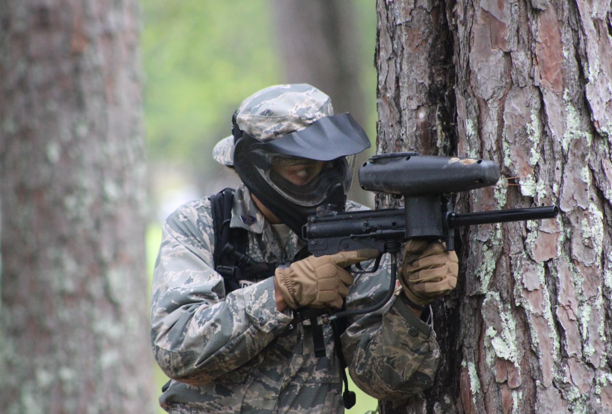 Air Force ROTC cadet takes aim during a field exercise in Puerto Rico.