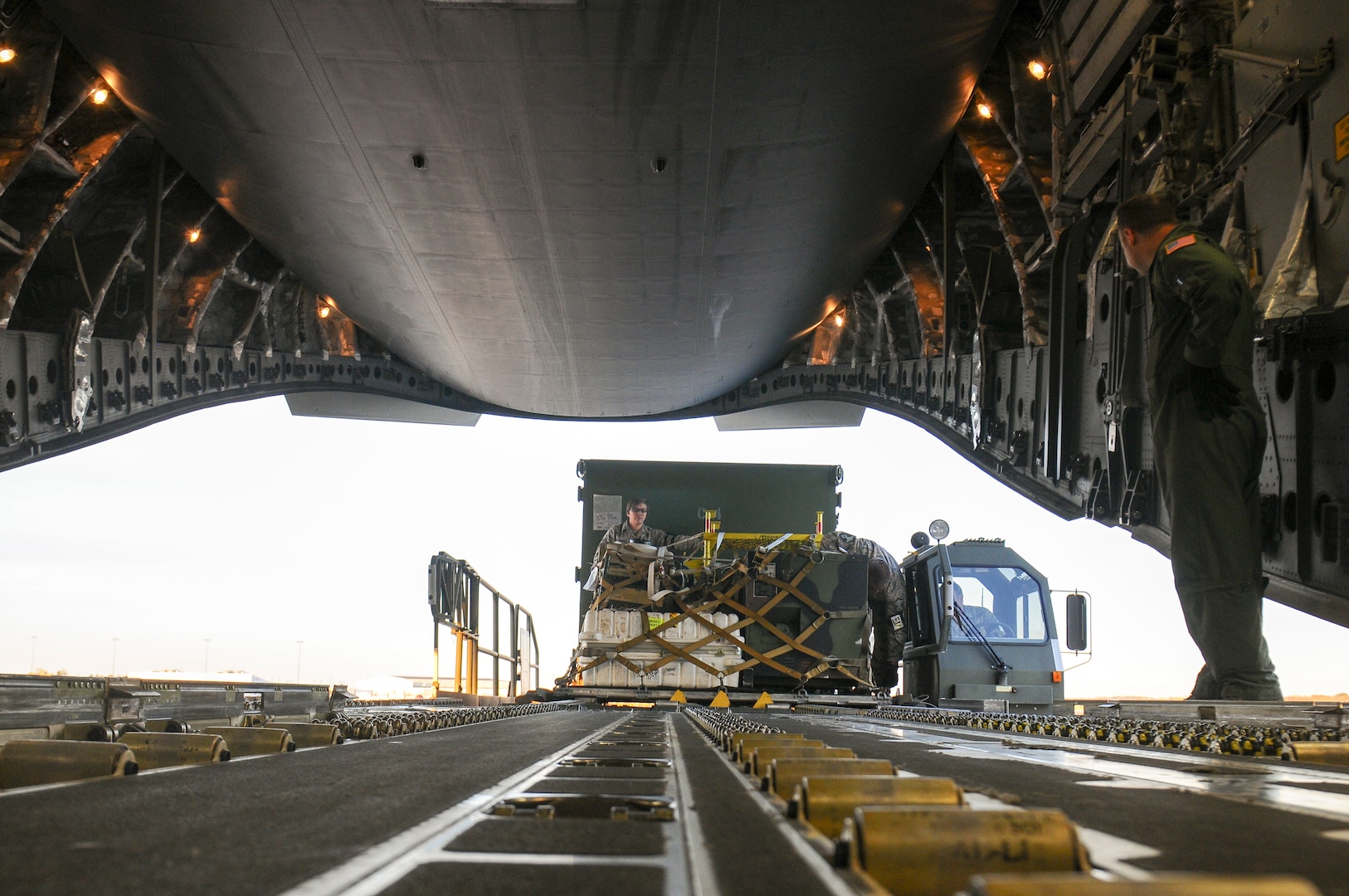 Members of the 121st Air Refueling Wing and 1st Battalion, 137th Aviation Regiment, assist members of the Tennessee National Guard’s 164th Airlift Wing with loading equipment and supplies into a C-17 Globemaster III Oct. 26, 2017, at Rickenbacker Air National Guard Base in Columbus, Ohio.