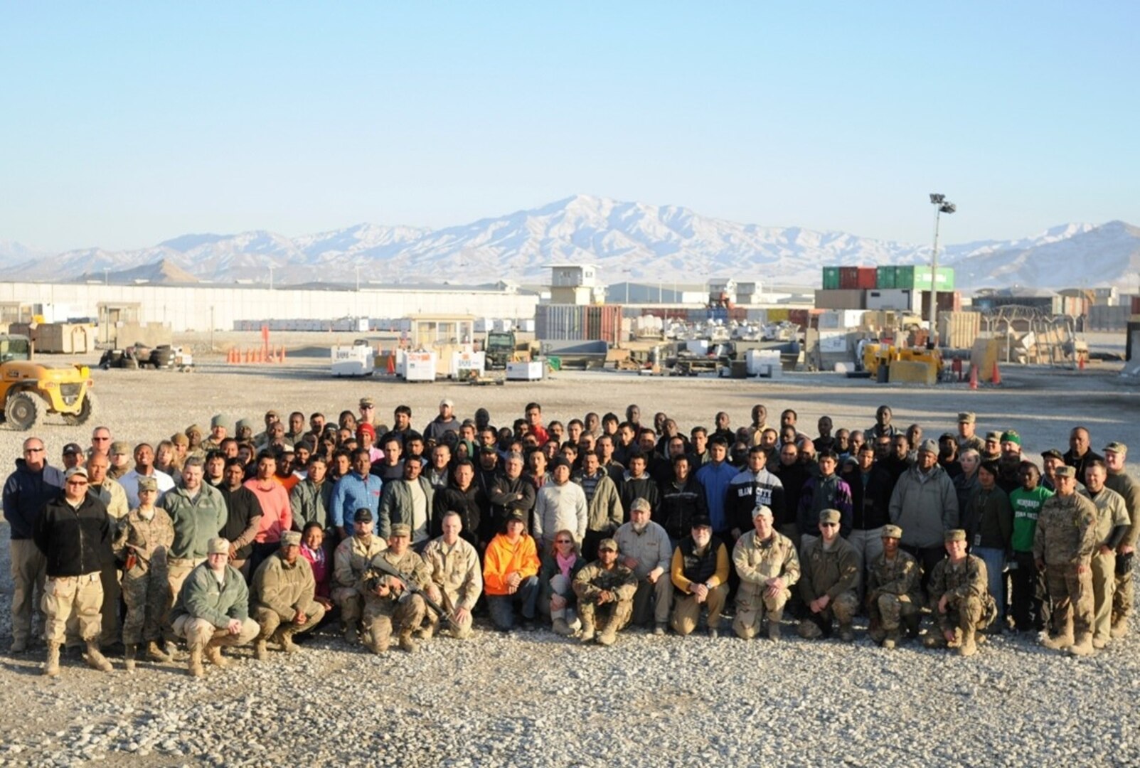 Large group of men and women from the DLA Support Team Afghanistan poses at the DLA Disposition Services yard in Bagram, Afghanistan.