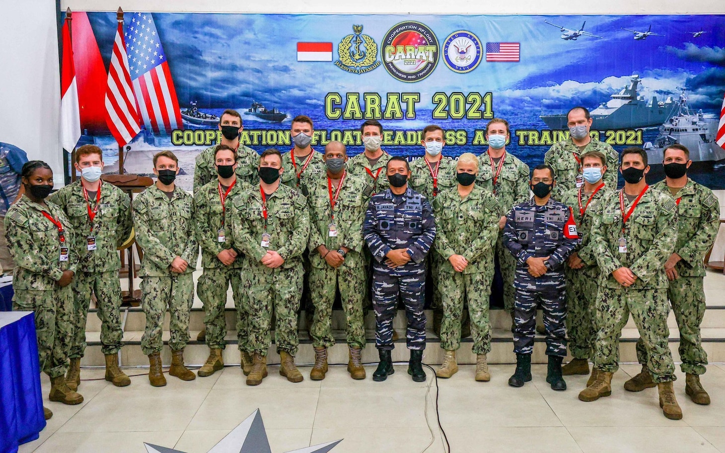 U.S. and Indonesian military personnel join during the opening ceremony for Cooperation Afloat and Readiness at Sea Training (CARAT) Indonesia 2021. In its 27th year, the CARAT series is comprised of multinational exercises, designed to enhance U.S. and partner navies’ abilities to operate together in response to traditional and non-traditional maritime security challenges in the Indo-Pacific region.